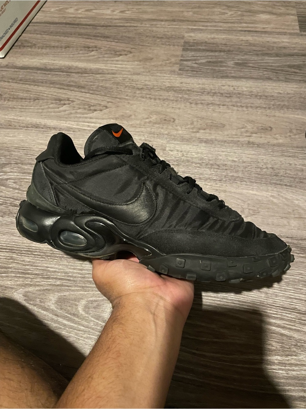 Nike Men’s Black Sneakers with Orange Swoosh Accent